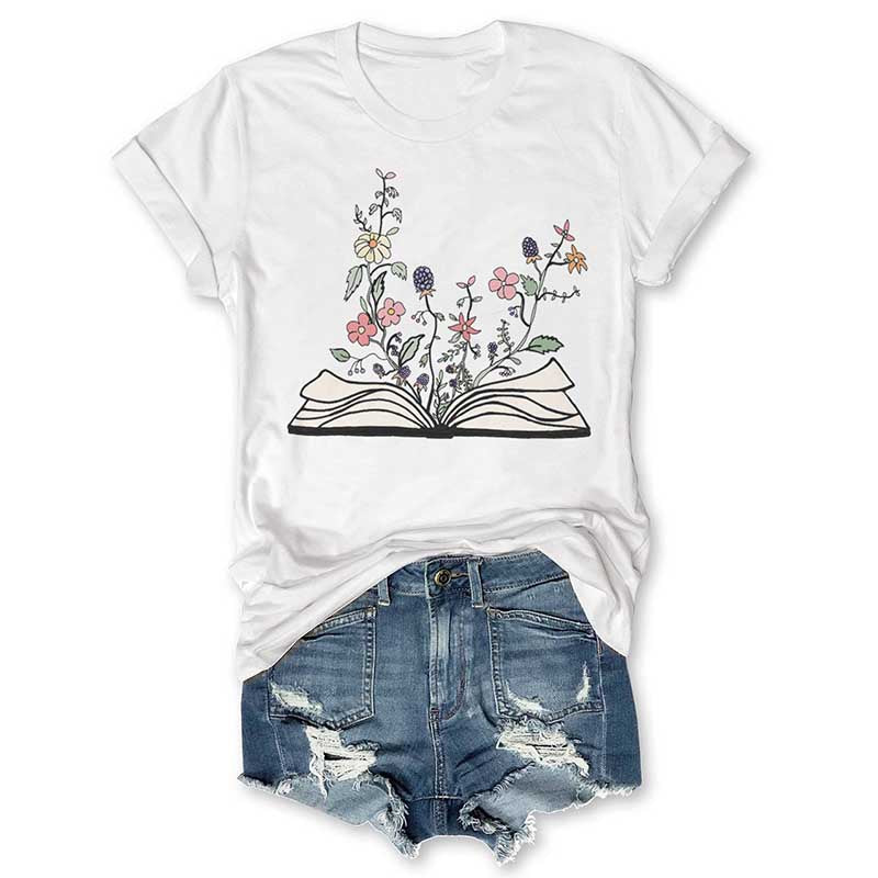 Blumen wachsen aus Buch-T-Shirt