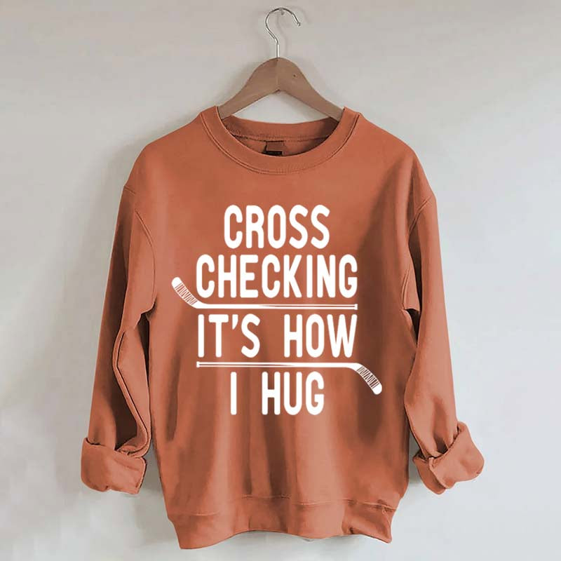 Cross Checking It's How I Hug Sweatshirt