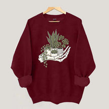 Skeleton Hand Cradling Potted Plants Sweatshirt