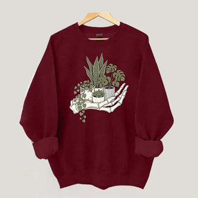 Skeleton Hand Cradling Potted Plants Sweatshirt