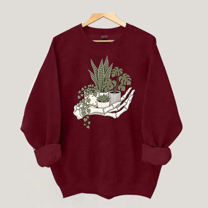 Skeleton Hand Cradling Potted Plants Sweatshirt
