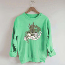 Skeleton Hand Cradling Potted Plants Sweatshirt