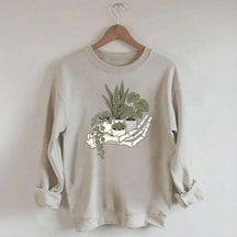 Skeleton Hand Cradling Potted Plants Sweatshirt