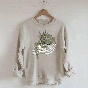 Skeleton Hand Cradling Potted Plants Sweatshirt