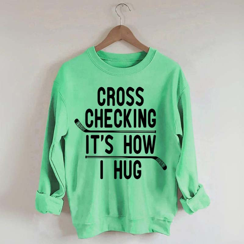 Cross Checking It's How I Hug Sweatshirt
