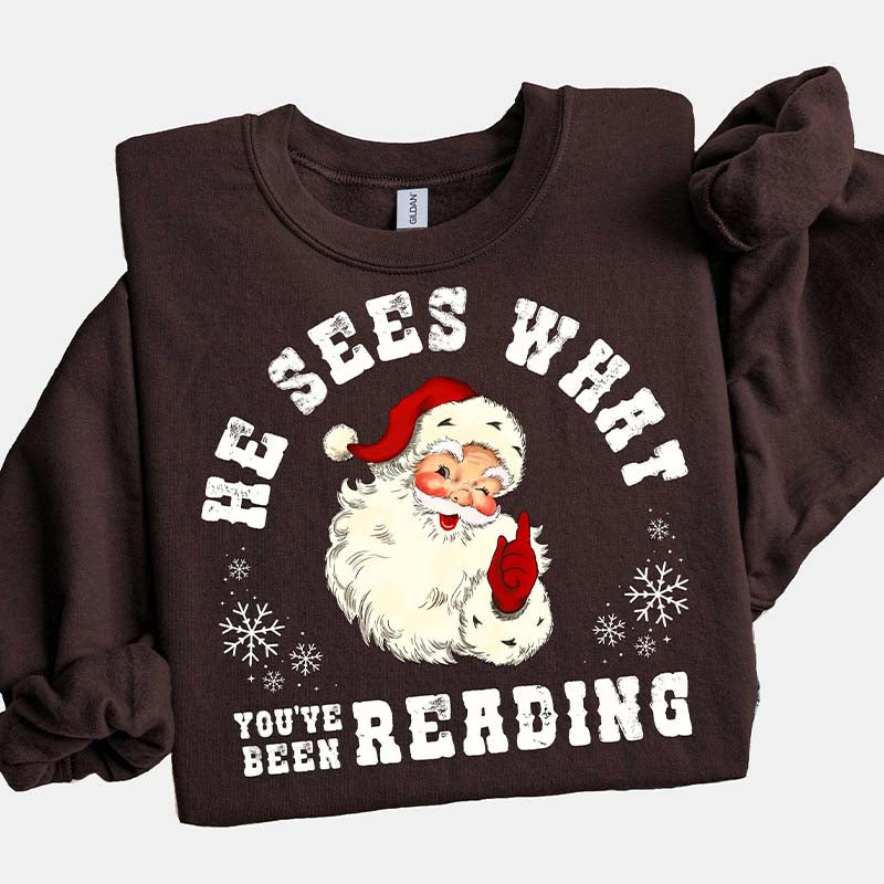 He Sees What You've Been Reading Santa Sweatshirt