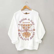 A Book A Day Keeps Reality Away Sweatshirt