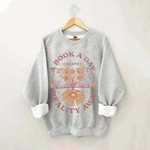 A Book A Day Keeps Reality Away Sweatshirt
