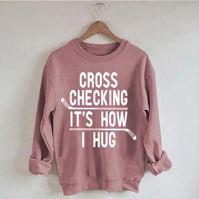Cross Checking It's How I Hug Sweatshirt