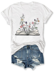 Fleurs poussant à partir de livre T-shirt