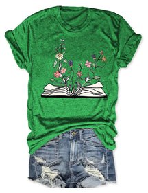 Blumen wachsen aus Buch-T-Shirt